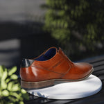 Men's Bugatti derby cognac leather shoes with a pointed toe and plain toe featuring a moulded heel , a pvc outsole , and laces fastening.