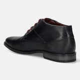 A blue Men's bugatti Chukka Boots featuring a round toe plain toe, stacked heel, and a wide fit. Made from premium genuine leather with a durable tpr outsole, this laces design offers both style and comfort.