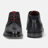 A blue Men's bugatti Chukka Boots featuring a round toe plain toe, stacked heel, and a wide fit. Made from premium genuine leather with a durable tpr outsole, this laces design offers both style and comfort.