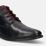 A blue Men's bugatti Chukka Boots featuring a round toe plain toe, stacked heel, and a wide fit. Made from premium genuine leather with a durable tpr outsole, this laces design offers both style and comfort.