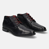 A blue Men's bugatti Chukka Boots featuring a round toe plain toe, stacked heel, and a wide fit. Made from premium genuine leather with a durable tpr outsole, this laces design offers both style and comfort.