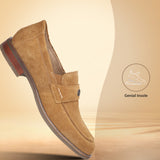 A beige Men's bugatti Penny Loafer featuring a round apron toe, moulded heel. Made from suede leather with a durable tr outsole, this slip-on design offers both style and comfort.