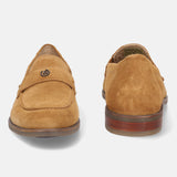 A beige Men's bugatti Penny Loafer featuring a round apron toe, moulded heel. Made from suede leather with a durable tr outsole, this slip-on design offers both style and comfort.