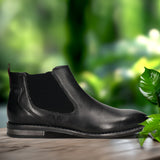 A black Men's bugatti Chelsea Boots featuring a round toe plain toe, moulded heel, and a wide fit. Made from premium genuine leather with a durable tr outsole, this zipper design offers both style and comfort.