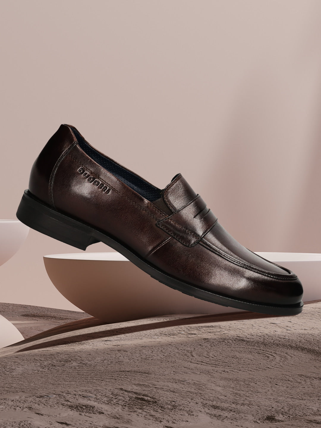 Men's Bugatti penny loafer brown leather shoes with a pointed toe and apron toe featuring a moulded heel , a tpr outsole.