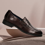 Men's Bugatti penny loafer brown leather shoes with a pointed toe and apron toe featuring a moulded heel , a tpr outsole.