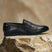 Men's Bugatti penny loafer black leather shoes with a pointed toe and apron toe featuring a stacked heel , a tpr outsole.