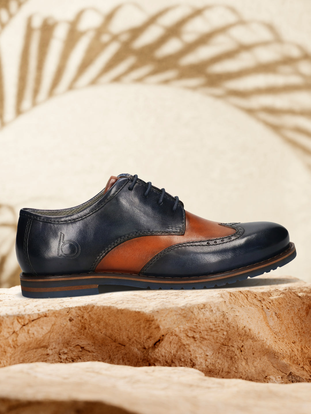Men's Bugatti derby blue leather shoes with a round toe and wing tip featuring a stacked heel , a eva outsole , and laces fastening.