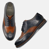 Men's Bugatti derby blue leather shoes with a round toe and wing tip featuring a stacked heel , a eva outsole , and laces fastening.