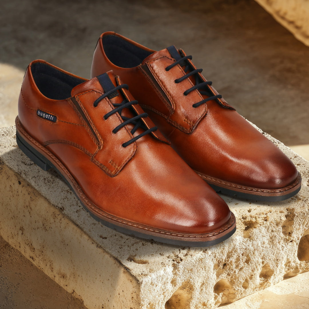 Men's Bugatti derby cognac leather shoes with a round toe and plain toe featuring a stacked heel , a tpr outsole , and laces fastening.