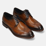 Men's Bugatti derby cognac leather shoes with a round toe and wing tip featuring a stacked heel , a leather outsole , and laces fastening.