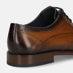 Men's Bugatti derby cognac leather shoes with a round toe and wing tip featuring a stacked heel , a leather outsole , and laces fastening.