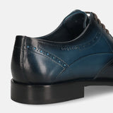 Men's Bugatti derby blue leather shoes with a round toe and wing tip featuring a stacked heel , a leather outsole , and laces fastening.