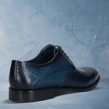 Men's Bugatti derby blue leather shoes with a round toe and wing tip featuring a stacked heel , a leather outsole , and laces fastening.