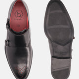 A black Men's bugatti Monk Shoe featuring a pointed plain toe, moulded heel. Made from premium genuine leather with a durable tr outsole, this slip-on design offers both style and comfort.