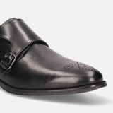 A black Men's bugatti Monk Shoe featuring a pointed plain toe, moulded heel. Made from premium genuine leather with a durable tr outsole, this slip-on design offers both style and comfort.
