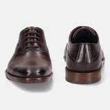 A grey Men's bugatti Oxford featuring a chisel toe plain toe, stacked heel. Made from premium genuine leather with a durable leather outsole, this laces design offers both style and comfort.