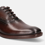 A grey Men's bugatti Oxford featuring a chisel toe plain toe, stacked heel. Made from premium genuine leather with a durable leather outsole, this laces design offers both style and comfort.
