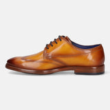 A yellow Men's bugatti Derby featuring a chisel wing tip, stacked heel. Made from premium genuine leather with a durable leather outsole, this laces design offers both style and comfort.