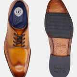 A yellow Men's bugatti Derby featuring a chisel wing tip, stacked heel. Made from premium genuine leather with a durable leather outsole, this laces design offers both style and comfort.