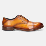A yellow Men's bugatti Oxford featuring a round cap toe, stacked heel. Made from premium genuine leather with a durable leather outsole, this laces design offers both style and comfort.