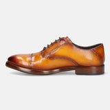 A yellow Men's bugatti Oxford featuring a round cap toe, stacked heel. Made from premium genuine leather with a durable leather outsole, this laces design offers both style and comfort.