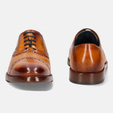 A yellow Men's bugatti Oxford featuring a round cap toe, stacked heel. Made from premium genuine leather with a durable leather outsole, this laces design offers both style and comfort.