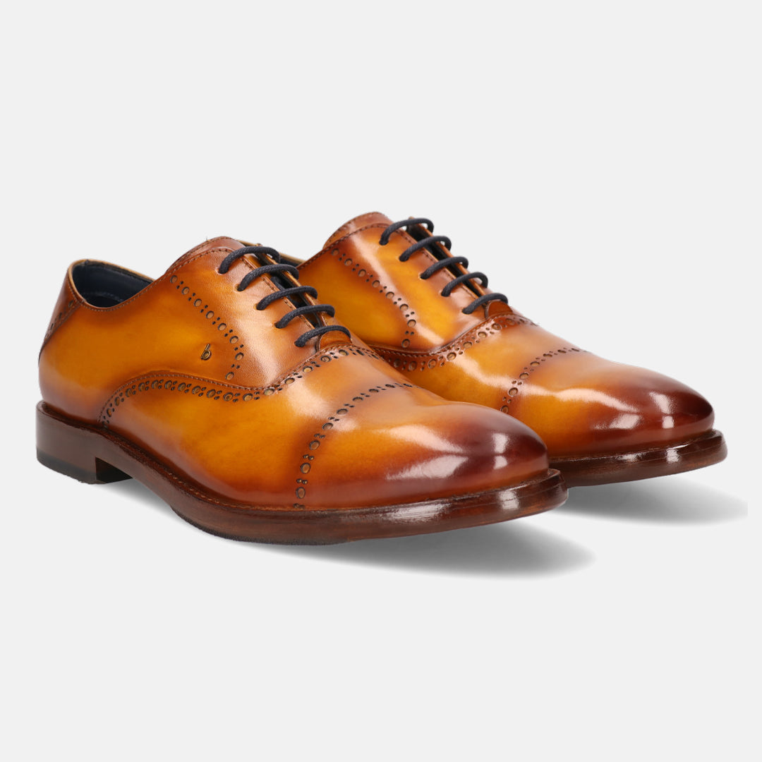 A yellow Men's bugatti Oxford featuring a round cap toe, stacked heel. Made from premium genuine leather with a durable leather outsole, this laces design offers both style and comfort.
