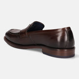 A brown Men's bugatti Venetian Loafers featuring a round toe apron toe, stacked heel. Made from premium genuine leather with a durable leather outsole, this slip-on design offers both style and comfort.