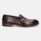 A brown Men's bugatti Venetian Loafers featuring a round toe apron toe, stacked heel. Made from premium genuine leather with a durable leather outsole, this slip-on design offers both style and comfort.