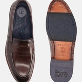 A brown Men's bugatti Venetian Loafers featuring a round toe apron toe, stacked heel. Made from premium genuine leather with a durable leather outsole, this slip-on design offers both style and comfort.