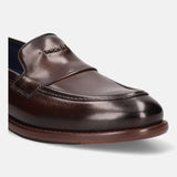 A brown Men's bugatti Venetian Loafers featuring a round toe apron toe, stacked heel. Made from premium genuine leather with a durable leather outsole, this slip-on design offers both style and comfort.