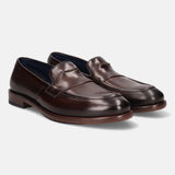 A brown Men's bugatti Venetian Loafers featuring a round toe apron toe, stacked heel. Made from premium genuine leather with a durable leather outsole, this slip-on design offers both style and comfort.