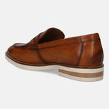 A cognac Men's bugatti Penny Loafer featuring a round apron toe, stacked heel. Made from premium genuine leather with a durable eva outsole, this slip-on design offers both style and comfort.