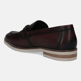 A grey Men's bugatti Bit Loafer featuring a round apron toe, stacked heel. Made from premium genuine leather with a durable eva outsole, this slip-on design offers both style and comfort.