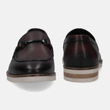 A grey Men's bugatti Bit Loafer featuring a round apron toe, stacked heel. Made from premium genuine leather with a durable eva outsole, this slip-on design offers both style and comfort.