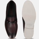 A grey Men's bugatti Bit Loafer featuring a round apron toe, stacked heel. Made from premium genuine leather with a durable eva outsole, this slip-on design offers both style and comfort.