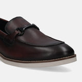 A grey Men's bugatti Bit Loafer featuring a round apron toe, stacked heel. Made from premium genuine leather with a durable eva outsole, this slip-on design offers both style and comfort.