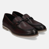 A grey Men's bugatti Bit Loafer featuring a round apron toe, stacked heel. Made from premium genuine leather with a durable eva outsole, this slip-on design offers both style and comfort.