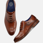 A cognac Men's bugatti Oxford featuring a almond toe medallion toe, stacked heel. Made from premium genuine leather with a durable leather outsole, this laces design offers both style and comfort.
