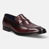 A grey Men's bugatti Penny Loafer featuring a round toe apron toe, stacked heel. Made from premium genuine leather with a durable leather outsole, this slip-on design offers both style and comfort.