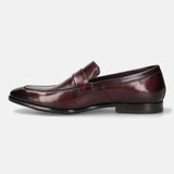 A grey Men's bugatti Penny Loafer featuring a round toe apron toe, stacked heel. Made from premium genuine leather with a durable leather outsole, this slip-on design offers both style and comfort.