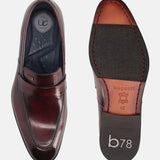 A grey Men's bugatti Penny Loafer featuring a round toe apron toe, stacked heel. Made from premium genuine leather with a durable leather outsole, this slip-on design offers both style and comfort.