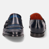 A blue Men's bugatti Kiltie Loafer featuring a round toe wingcap, stacked heel. Made from premium genuine leather with a durable leather outsole, this buckle design offers both style and comfort.