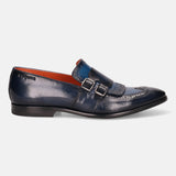 A blue Men's bugatti Kiltie Loafer featuring a round toe wingcap, stacked heel. Made from premium genuine leather with a durable leather outsole, this buckle design offers both style and comfort.