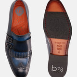 A blue Men's bugatti Kiltie Loafer featuring a round toe wingcap, stacked heel. Made from premium genuine leather with a durable leather outsole, this buckle design offers both style and comfort.