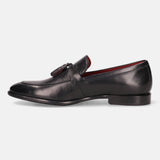 A black Men's bugatti Tassel Loafers featuring a round apron toe, stacked heel. Made from premium genuine leather with a durable leather outsole, this slip-on design offers both style and comfort.