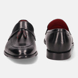 A black Men's bugatti Tassel Loafers featuring a round apron toe, stacked heel. Made from premium genuine leather with a durable leather outsole, this slip-on design offers both style and comfort.