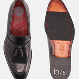 A black Men's bugatti Tassel Loafers featuring a round apron toe, stacked heel. Made from premium genuine leather with a durable leather outsole, this slip-on design offers both style and comfort.