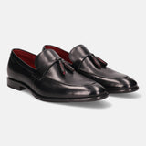 A black Men's bugatti Tassel Loafers featuring a round apron toe, stacked heel. Made from premium genuine leather with a durable leather outsole, this slip-on design offers both style and comfort.